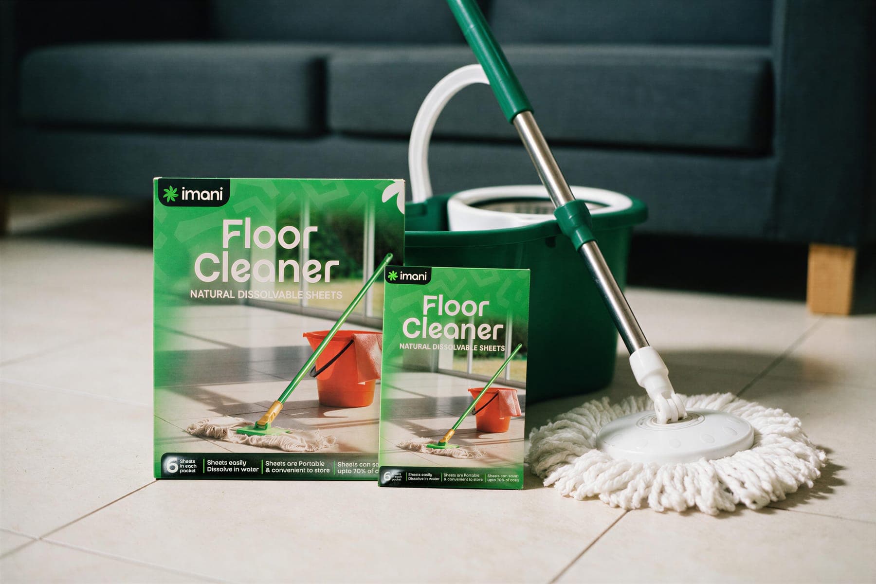 Floor Cleaner packs beside a mop and bucket